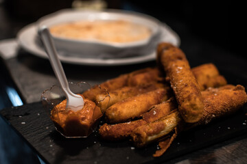 Fried fingers with orange sauce
