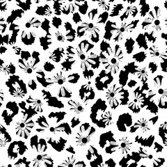 Continuous black and white animal print design combined with daisies. Pattern seamless for textile industry. 