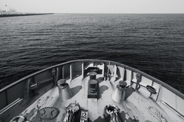 Bow of a tug boat and seawater. Blue toned photo