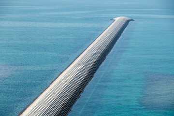 Obraz premium Breakwater made of concrete blocks.
