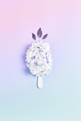 floral ice cream. simple floral arrangement of fresh hydrangea flowers on a pink background. summer layout, flat lay