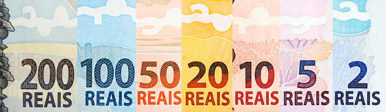 banknotes of money of brazil, in composite. Details of notes of 200, 100, 50, 20, 10, 5 and 2 reais. Brazil economy concept, new two hundred reais note in detail