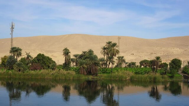 Egypt Nile river side view felucca boat and telephone signal tower