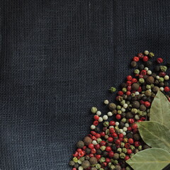 red and black pepper on a black background