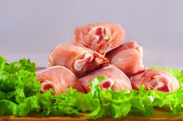 raw chicken legs and green salad