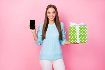 Photo of pretty lady hold telephone big gift box hands presenting new smart phone model advising...