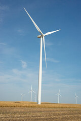 Wind turbines in the fields, renewable energy concept