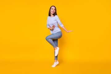 Fototapeta na wymiar Full length body size view of her she nice attractive pretty girlish cheerful cheery girl jumping having fun dancing good mood spring isolated bright vivid shine vibrant yellow color background