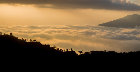 Scenic view of clouds and mist at sunrise