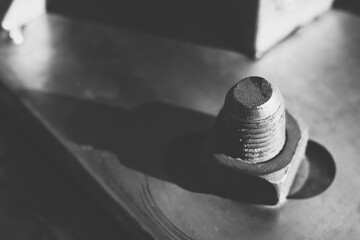 Bolt and nut in black and white abstract background