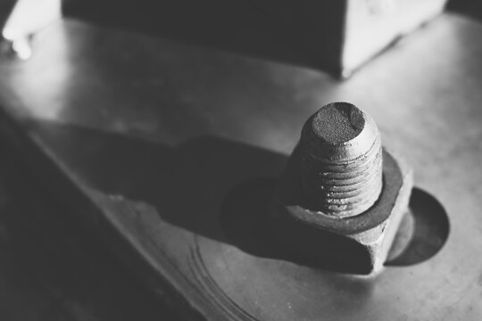 Bolt and nut in black and white abstract background