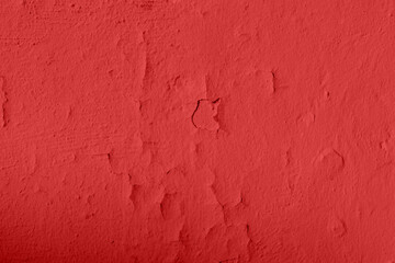Red cracked paint texture. Background of old red surface with paint swell