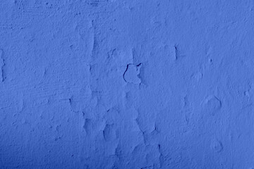 The texture of the iron metal painted blue paint shabby old shabby scratched cracked ancient metal sheet wall. The background.