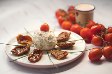 Delicious rustic breakfast - farm boursin goat cheese with sun-dried tomato,shallot onion and fresh cherry tomatoes
