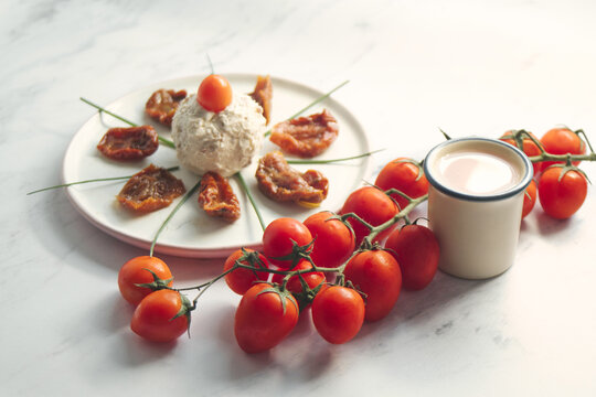Delicious rustic breakfast - farm boursin goat cheese with sun-dried tomato,shallot onion and fresh cherry tomatoes