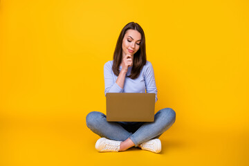 Full body photo of minded pensive girl sit floor legs crossed work remote laptop think thoughts report document wear style stylish violet clothes isolated bright shine color background