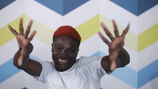Happy African American man overjoyed by great news. Motivated businessman, Good work result. Emotions of a young man from business success.