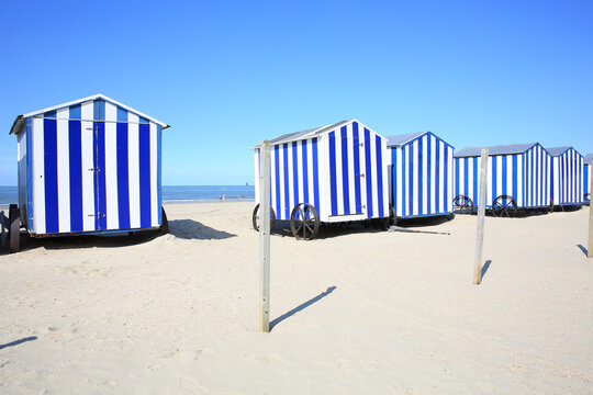 Cabanas on the sand beach in De Panne, West Flanders, Belgium