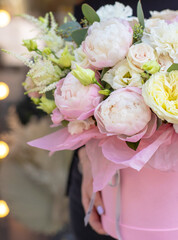  Bouquet in box. Gift box with beautiful flower. Woman holding big beautiful blossoming box bouquet of fresh roses, lilac, freesia, eustoma and others.