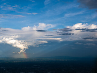 Naklejka na ściany i meble Light Shines as a Beam of Light becomes The Rainbow Above The City of Chiang Mai