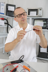 middle age technician fixing device