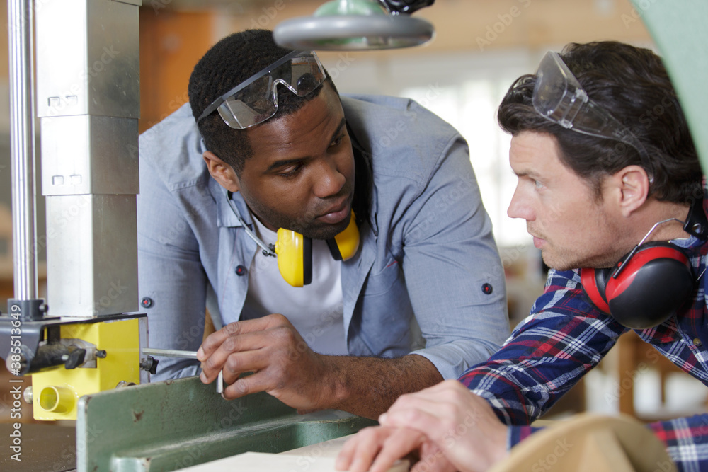 Wall mural two men in a workshop