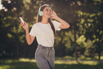 Portrait of her she nice attractive pretty cheerful cheery slim fit thin girl enjoying spending time listening singing hit single stereo sound playlist dancing sunny day