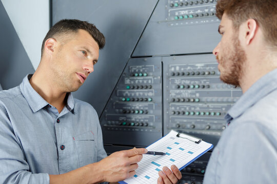 portrait of engineer ordering to worker