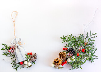 Christmas and New Year card, composition, spruce, cones, berries on a white background. Flat lay, copy space, top view