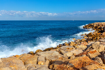 Panoramic view of stony Mediterranean coastline and beaches in south districts of metropolitan Tel Aviv seen from Midron Yaffo Park in Tel Aviv Jaffo, Israel