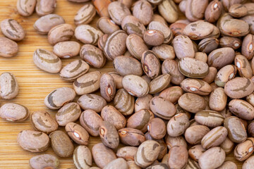 brown beans seeds on a wooden table