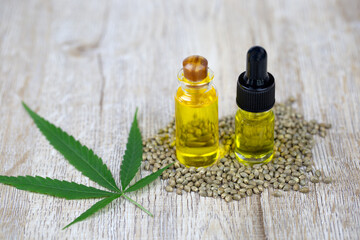 Glass bottles containing hemp oil, CBD and medicine extracted from hemp oil. Concept Medical options CBD hemp oil products Therapy with herbs that are extracted from cannabis.