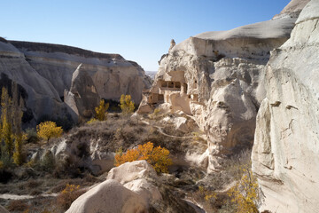 Sandstone cave dwellings in the valley of Cappadocia. Cave town in volcanic rock formations.