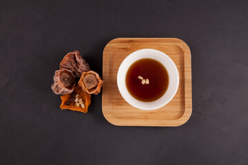 Sujeonggwa is a traditional Korean drink. Dark reddish brown in color, it is made from gotgam...