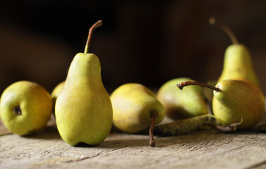 Fototapeta na wymiar Composition of fresh Pears on boards. Dark background Side view