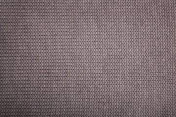 The texture of a knitted wool gray. Background