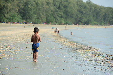 View of the sandy beach and the island on the beach in Trang, Thailand