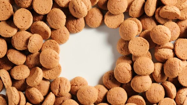 Dutch holiday Sinterklaas background with rotation kruidnoten, traditional sweets, strooigoed. St. Nicolas day concept with copy space for text. 4K video, 50 fps