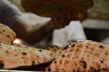 Traditional Bosnian Somun flatbread bread being prepared in a bakery in the capital of Sarajevo