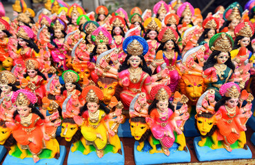 Idols of Goddess Durga sitting on Lion. The nine-day Durga Puja festival, which commemorates the slaying of the demon king Mahishasur by the goddess Durga, marks the triumph of good over evil.