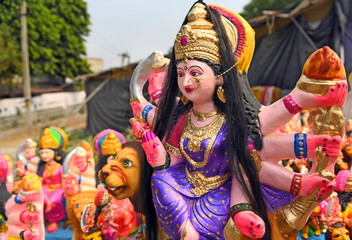 Idols of Goddess Durga sitting on Lion. The nine-day Durga Puja festival, which commemorates the slaying of the demon king Mahishasur by the goddess Durga, marks the triumph of good over evil.