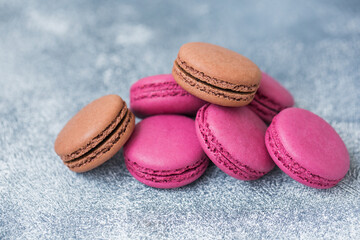 Macaron cookies with black currants close-up