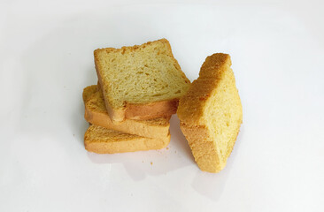 crispy rusk, cake rusk, cardamom rusk, Crunchy or Toast for healthy life, Traditional biscuit tray with tea, toasts for breakfast and cup of fresh milk & Tea, dry toasty bread, crunchy toast, pau,