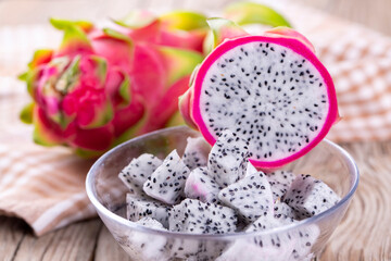 Dragon fruit isolated on wooden background, fresh pitahaya