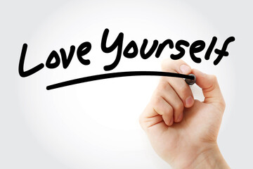 Love Yourself text with marker, concept background
