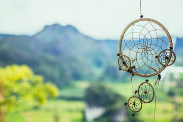 Dream catcher with blur natural mountain view background. - Hope and dream concept.