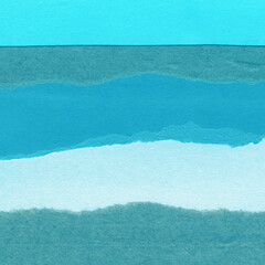 Blue torn paper collage close-up. Texture made from various paper and cardboard parts. Damaged old...