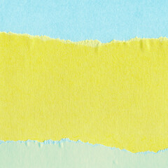 Blue torn paper collage close-up. Texture made from various paper and cardboard parts. Damaged old...