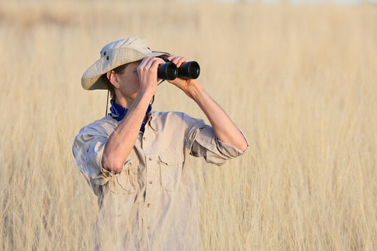 Safari Man Looking Through Binoculars