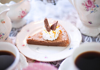 Chocolate cake with orange and whipped cream